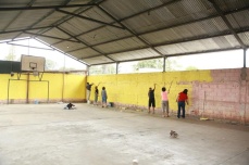A team of women paints the gym in one day